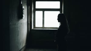 woman looking at wall